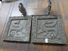 A pair of panels carved with dragons together with a antique sliding book rack (3)