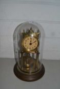 Brass anniversary clock under glass dome