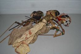 Three Asian painted wooden puppets