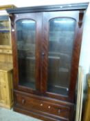 Victorian and later glazed two door cabinet with single drawer base