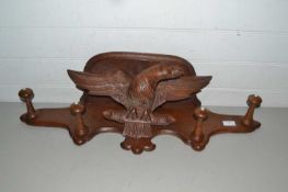 Continental hardwood coat rack decorated with carved eagle mount