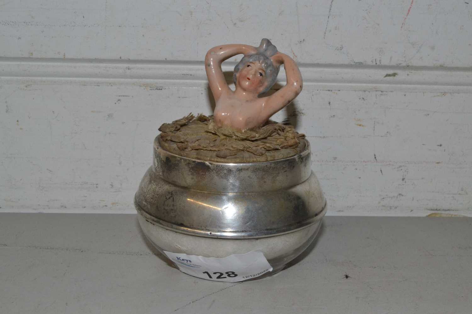 Porcelain powder puff girl in silver mounted glass container