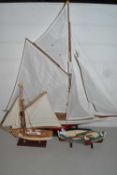 Two model yachts and a further model rowing boat (3)