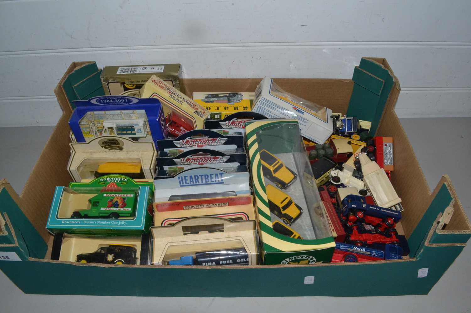 Box of various toy vehicles mainly vans