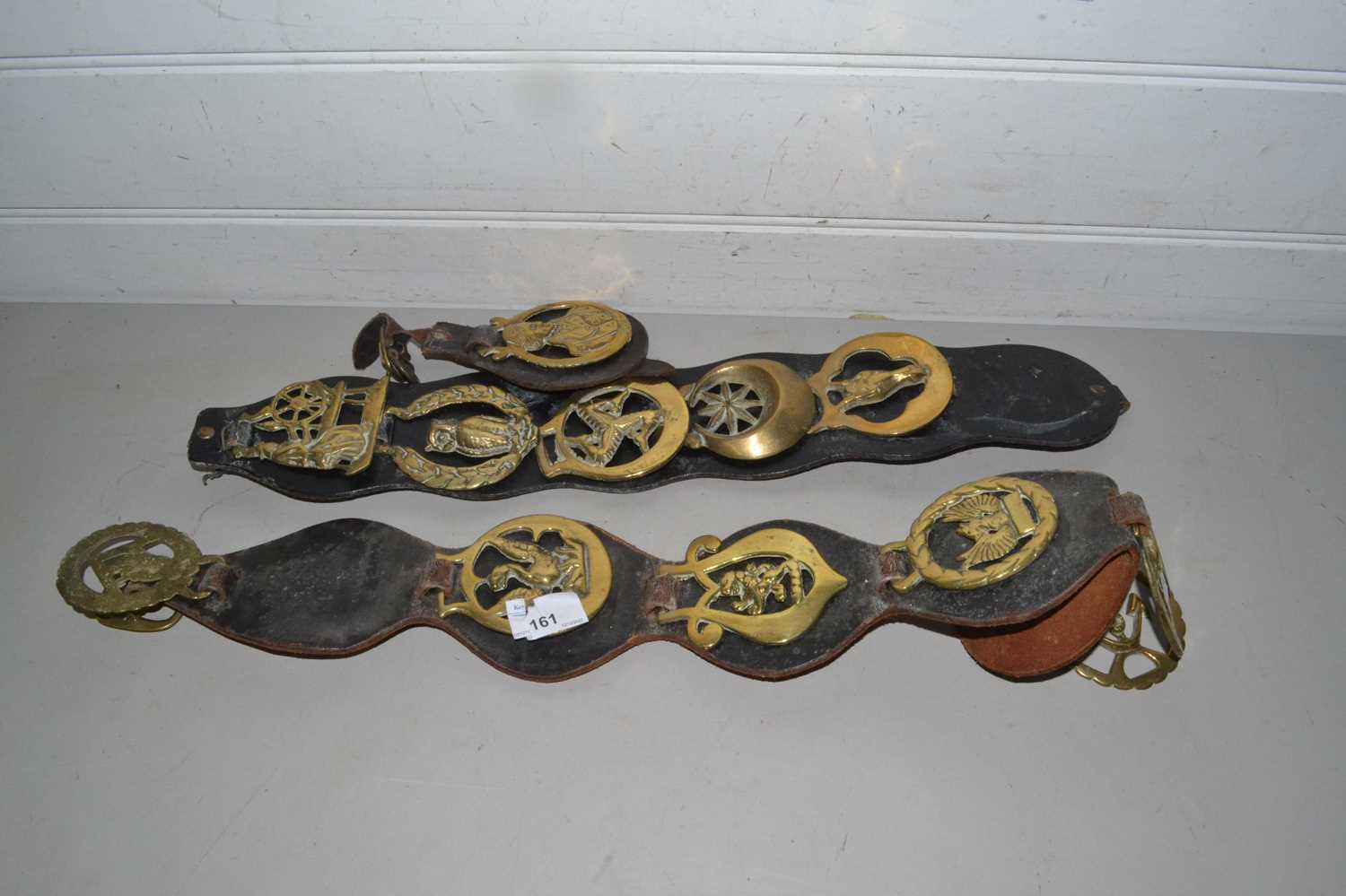 Collection of horse brasses on leather straps