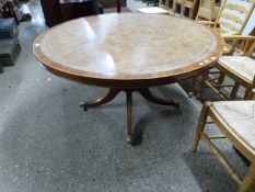 Reproduction circular leather topped pedestal dining table on four outswept legs, 138cm wide