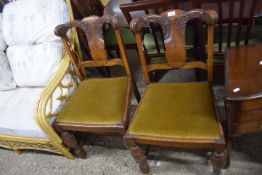 Pair of oak dining chairs with carved floral decoration