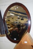 Dark wood framed oval wall mirror