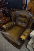 Brown leather armchair