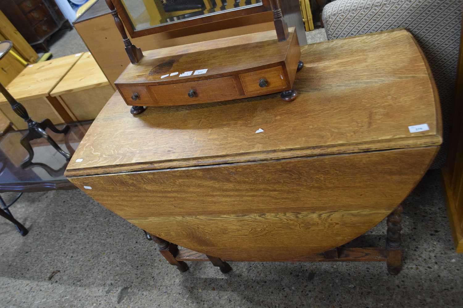 Early 20th Century oak drop leaf dining table on barley twist legs, 108cm wide