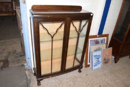 Early 20th Century bow front china display cabinet on ball and claw feet, 68cm wide