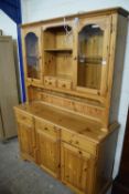 Modern pine dresser cabinet with glazed top section and drawer and cupboard base, 132cm wide