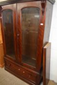 Victorian and later glazed two door cabinet with single drawer base