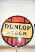 Circular double sided enamel sign marked Dunlop Stock, 61 cm diameter