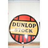 Circular double sided enamel sign marked Dunlop Stock, 61 cm diameter