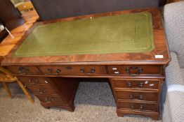 Reproduction mahogany twin pedestal office desk with green leather inset top, 122cm wide