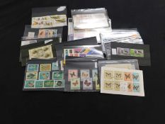Packet: Assorted mint and used modern world stamps on stock cards