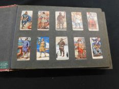 Old cigarette card album with Player, 7 sets and 3 part sets, the sets comprising Cricketers 1930,
