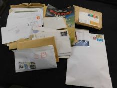 Box of assorted world stamps in envelopes and packets