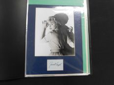 Modern folder with mounted photo of actress Janet Leigh, approx 250 x 200 mm, signed slip in panel