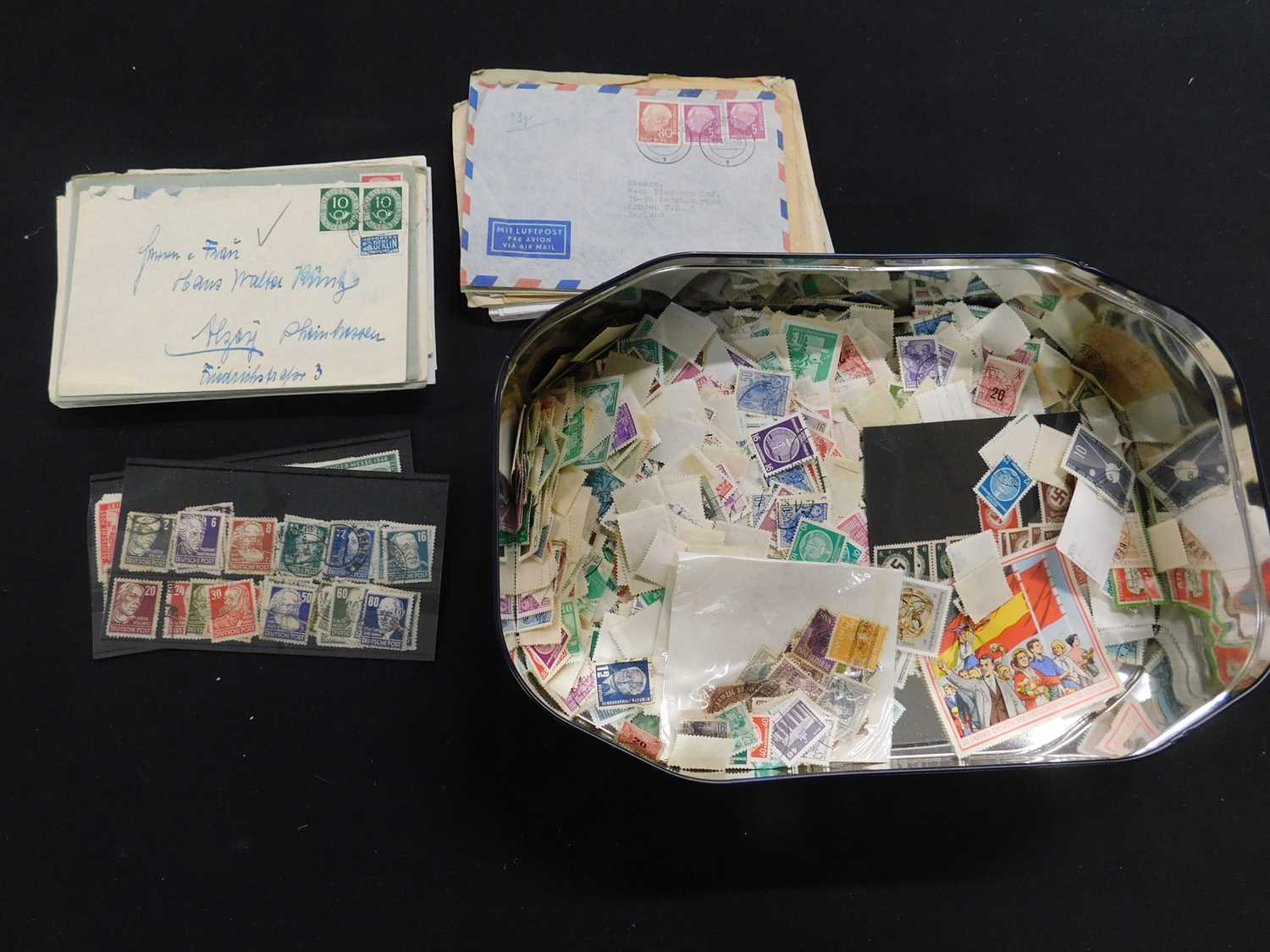 Victoria biscuit tin containing assorted German stamps, loose, also on stock cards and covers