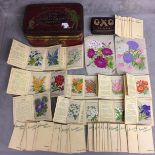 Quantity of vintage silk flower cards and vintage oxo tins