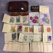 Quantity of vintage silk flower cards and vintage oxo tins