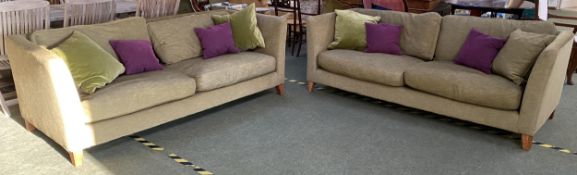 Two good John Lewis sofas, upholstered in green fabric, with decorative cushions, 210cm long, x 96cm