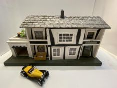 Mid C20th dolls house, including contents, and Bugatti type 1932 car model, some minor wear, in used
