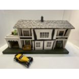 Mid C20th dolls house, including contents, and Bugatti type 1932 car model, some minor wear, in used