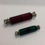 Two Victorian white metal mounted double ended scent bottles, 1 cranberry, 1 emerald colour glass,