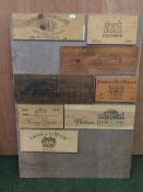 Wooden board, with various old wine cases / wine names attached, as found