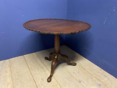 A Mahogany pedestal tripod based and pie crust circular top side table (some repair and foot broken)