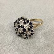 9 ct gold sapphire and diamond cluster ring set throughout with circular free cut sapphires and