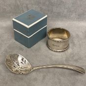 Sterling silver sugar sifter spoon and a sterling silver napkin ring boxed