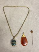 Banded agate chain, and a gilt and paste enamel egg, and a stick pin