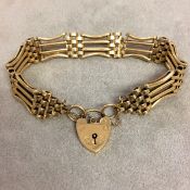 9 ct gold gate link bracelet with 9ct gold locket charm 23 g