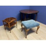 An oval drop leaf table, a canterbury and a blue upholstered stool