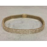 9ct gold and diamond bracelet set with triple line of single cut diamonds 17.8 g 19cm