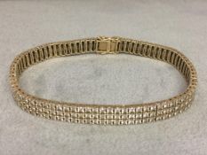 9ct gold and diamond bracelet set with triple line of single cut diamonds 17.8 g 19cm