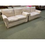 Pair of two seater sofas with loose cream covers, some minor marks, generally in good order,