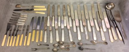 A large quantity of flatware, including bone handled knives and forks etc and knife rests