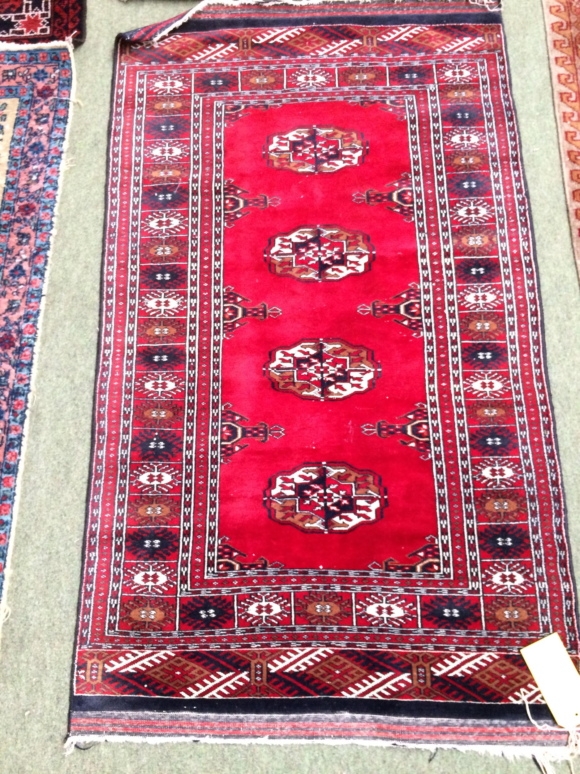 4 rugs, 3 red ground rugs with all over geometric stylized designs, and a blue and red ground Tree - Image 3 of 9
