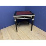 A black and gilt decorated square occasional table, with inset red leather top, ex De Gaunay show