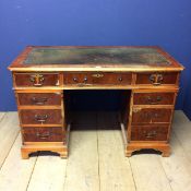 9 drawer bureau, with green leather top, in need of attention, much wear 77h x 123w x 62d cm