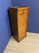 A vintage honey coloured oak tambour fronted cabinet