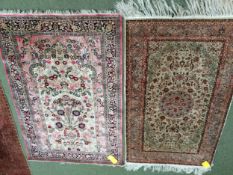 2 silk rugs, 158 x 102cm; 153 x 93cm, one with square green panel ground and red geometric wide