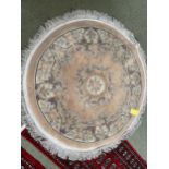 Chinese wash style circular rug with soft pink and grey floral designs 127cm diameter