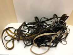 Quantity of tack, to include bridles, good set of reins etc