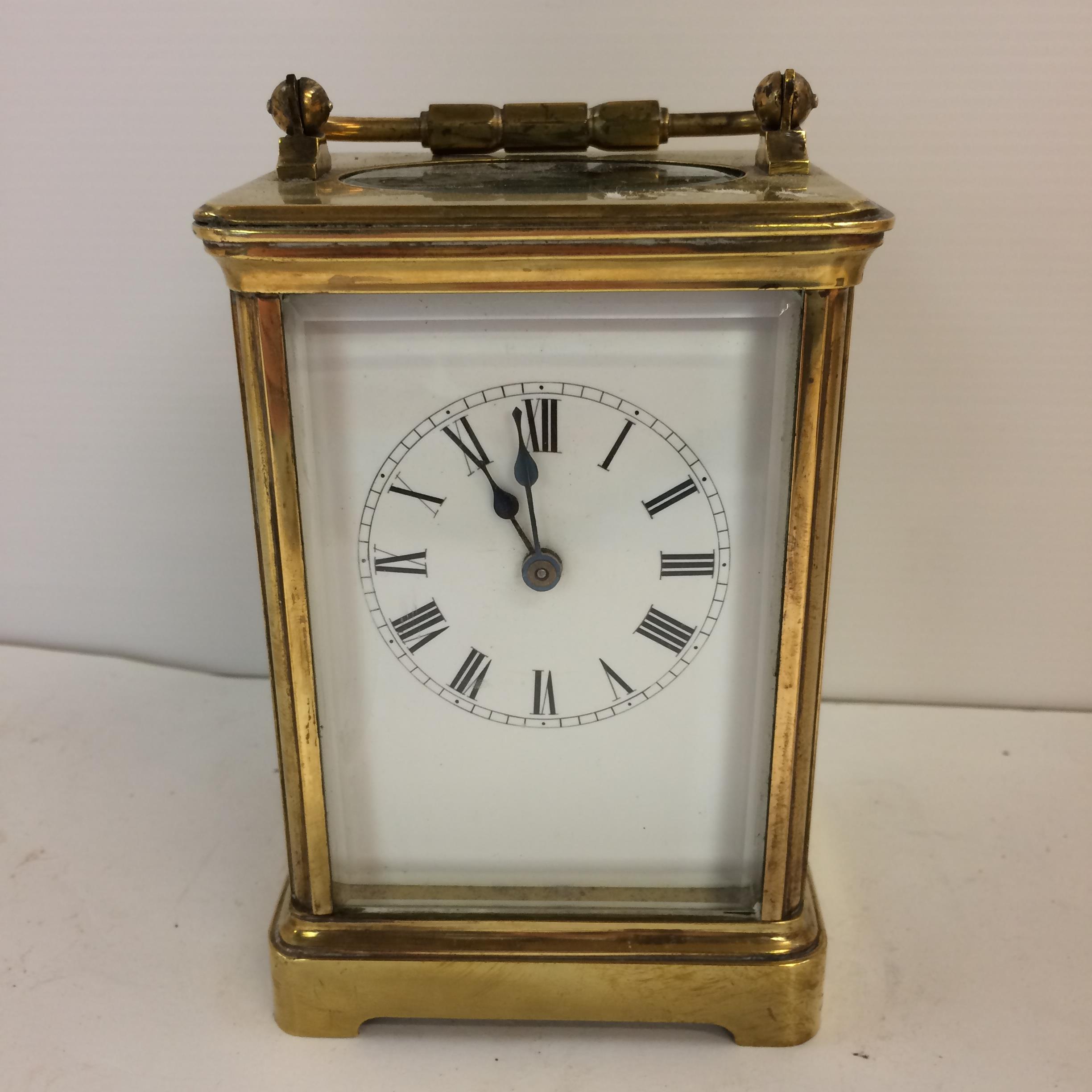 French gilt brass carriage clock with 4 bevelled glass panes with key